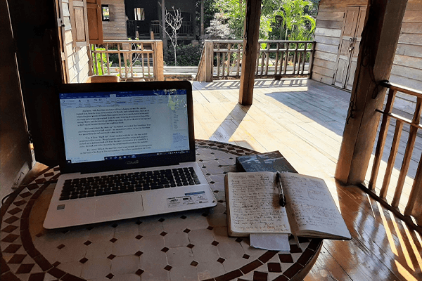 Author Frank Hurst in Chinang Mai. Computer on table